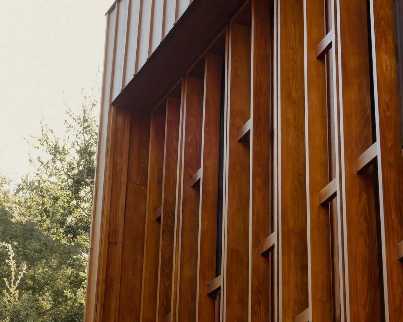 Detail of a modern building's vertical wood-slat facade